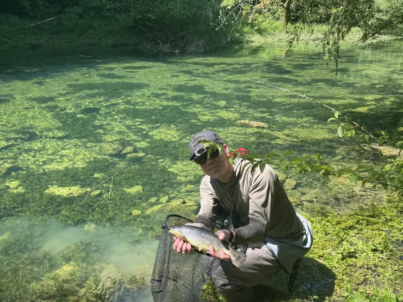 bosnia-angler-landing-trout-river