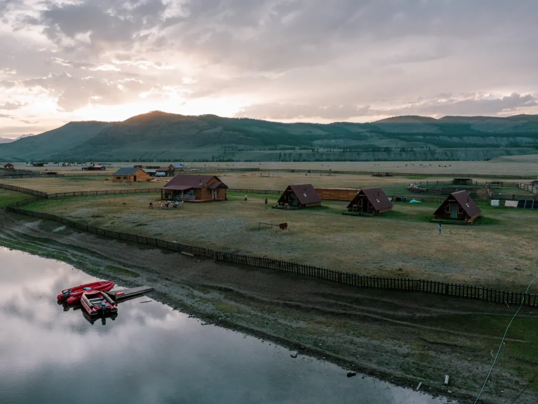 mongolia-aerial-river-fishing-camp-cabins-dusk-41