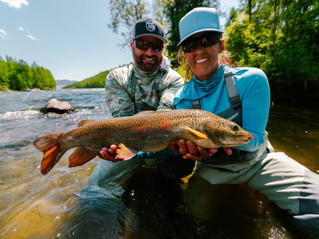 mongolia-couple-holding-lenok-trout-riverbank-10