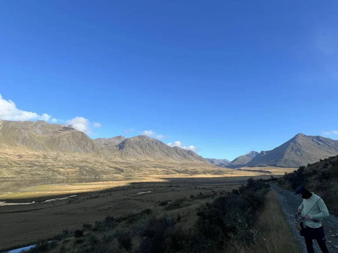 nz-qt-river-day-angler-walking-valley
